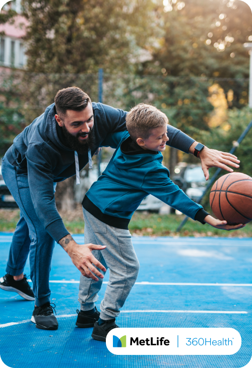 Father and son playing basketball