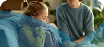 Child on sofa with parent