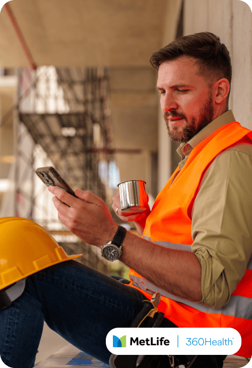 Man at a construction site on his phone