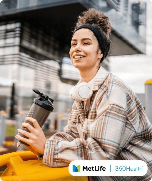 Woman holding water bottle outdoors, representing everyday health and wellness.