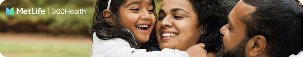 Close up of family smiling outside. 