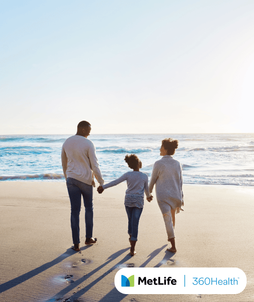 Family walking on a beach.