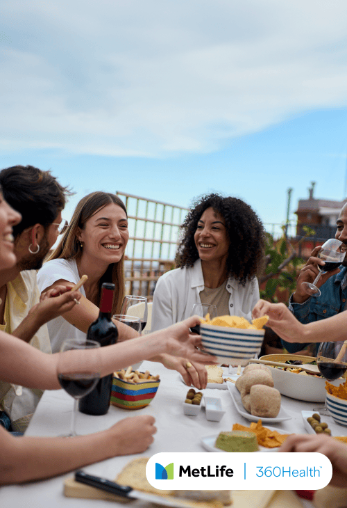 Friends eating together outside.