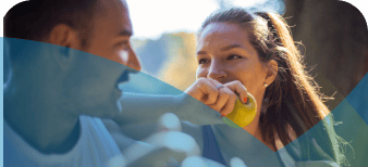 Woman holding an apple in the sun